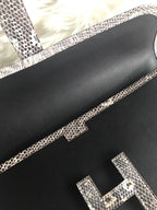JIGE ELAN 29 CLUTCH IN BLACK CALFSKIN WITH WHITE LIZARD SKIN