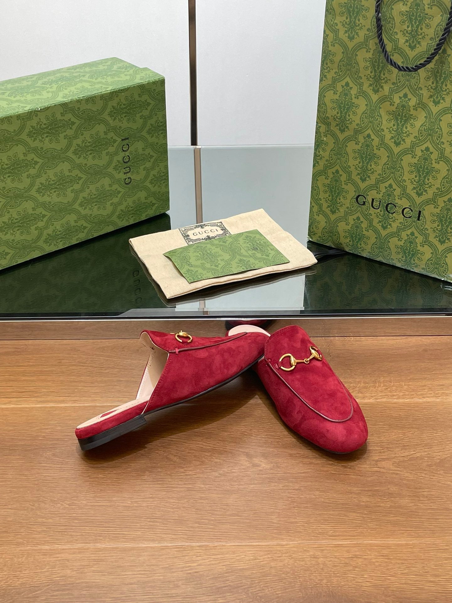 HORSEBIT MULE IN CHERRY RED SUEDE WITH GOLD HARDWARE