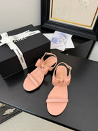 FLAT SANDALS IN PEACHY PINK CALFSKIN WITH BOW