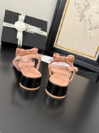 FLAT SANDALS IN PEACHY PINK CALFSKIN WITH BOW