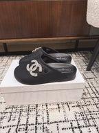 FLAT MULES IN BLACK CALFSKIN